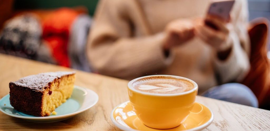 Coffee Latte And Orange Cake On Table